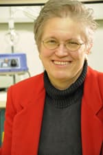 A picture of Mary Rusek, smiling and with glasses